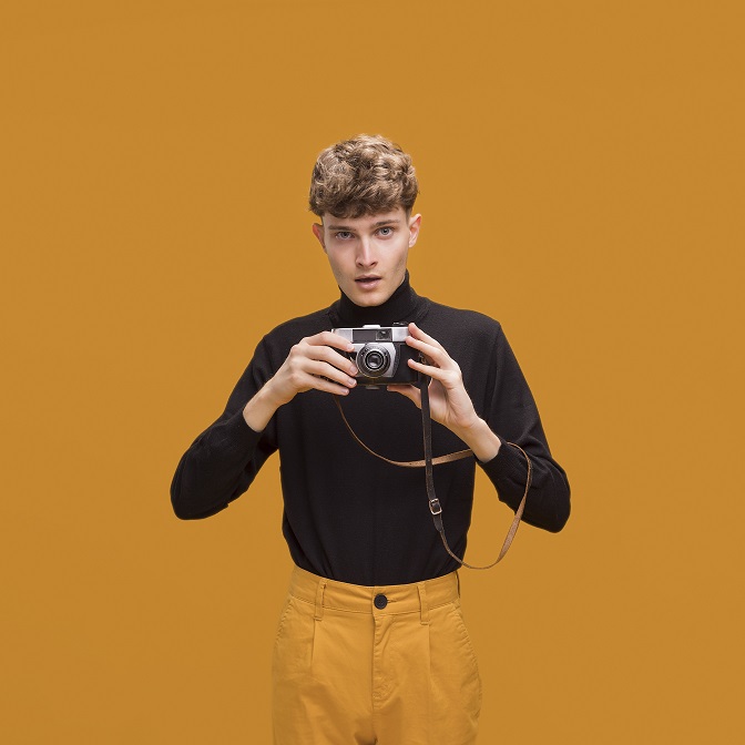 man-with-camera-yellow-scene